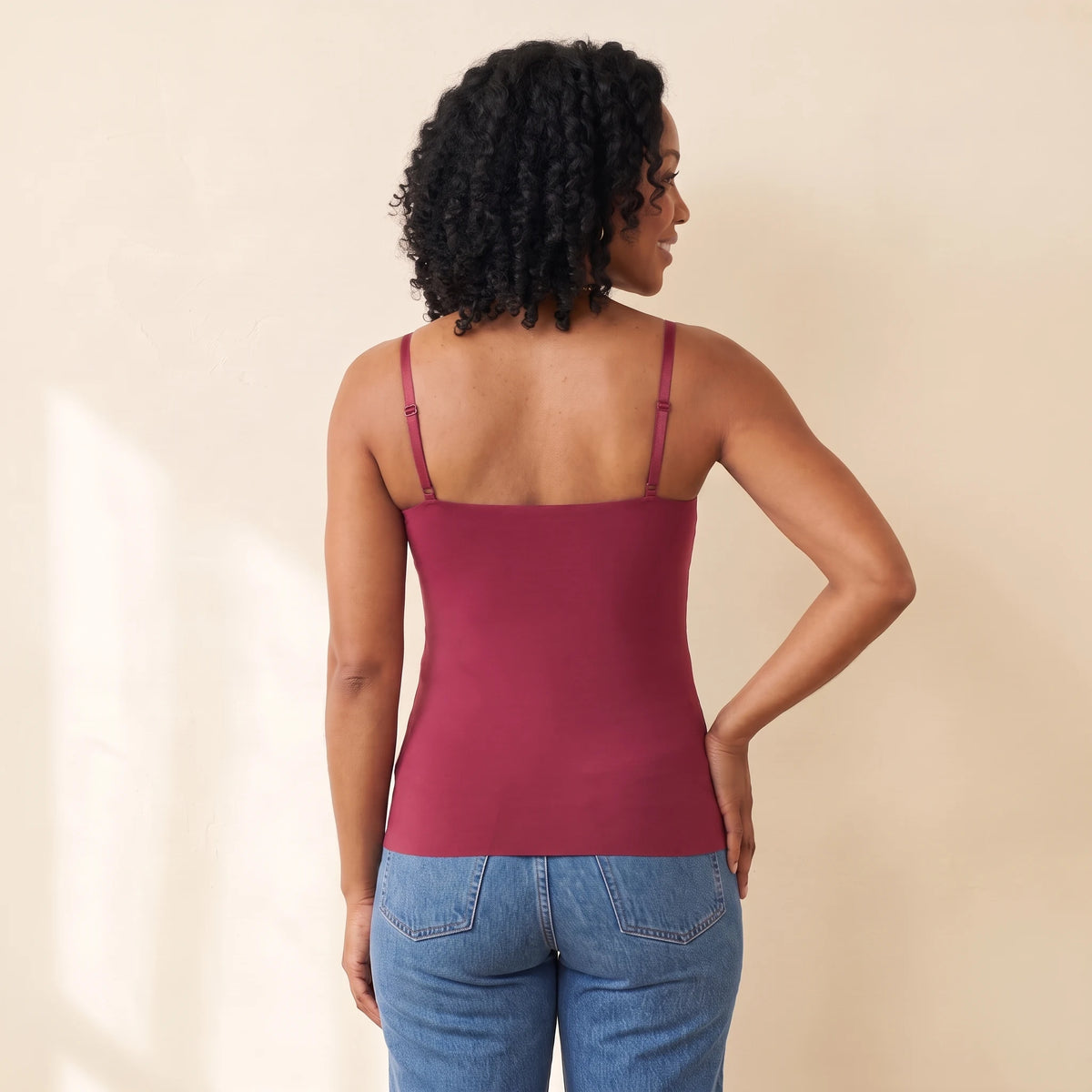 Back view of the Cerise burgundy Kischt Aurelle tank top with thin adjustable straps and a smooth back with no bra lines