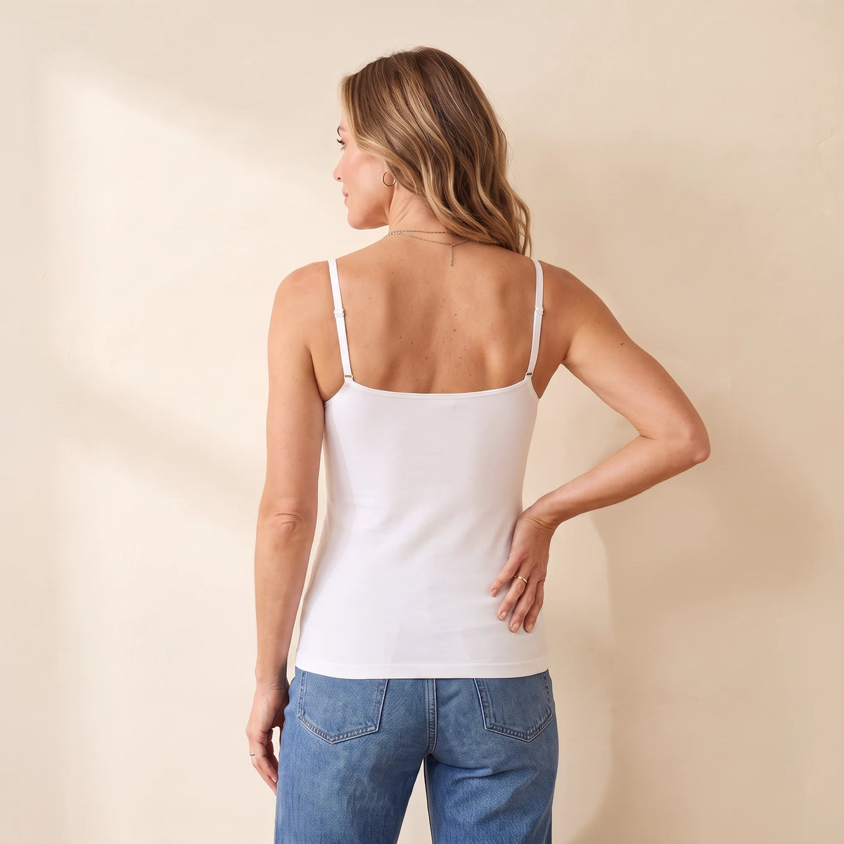 Back view of the Cloud white Kischt Aurelle tank top with thin adjustable straps and a smooth back with no bra lines