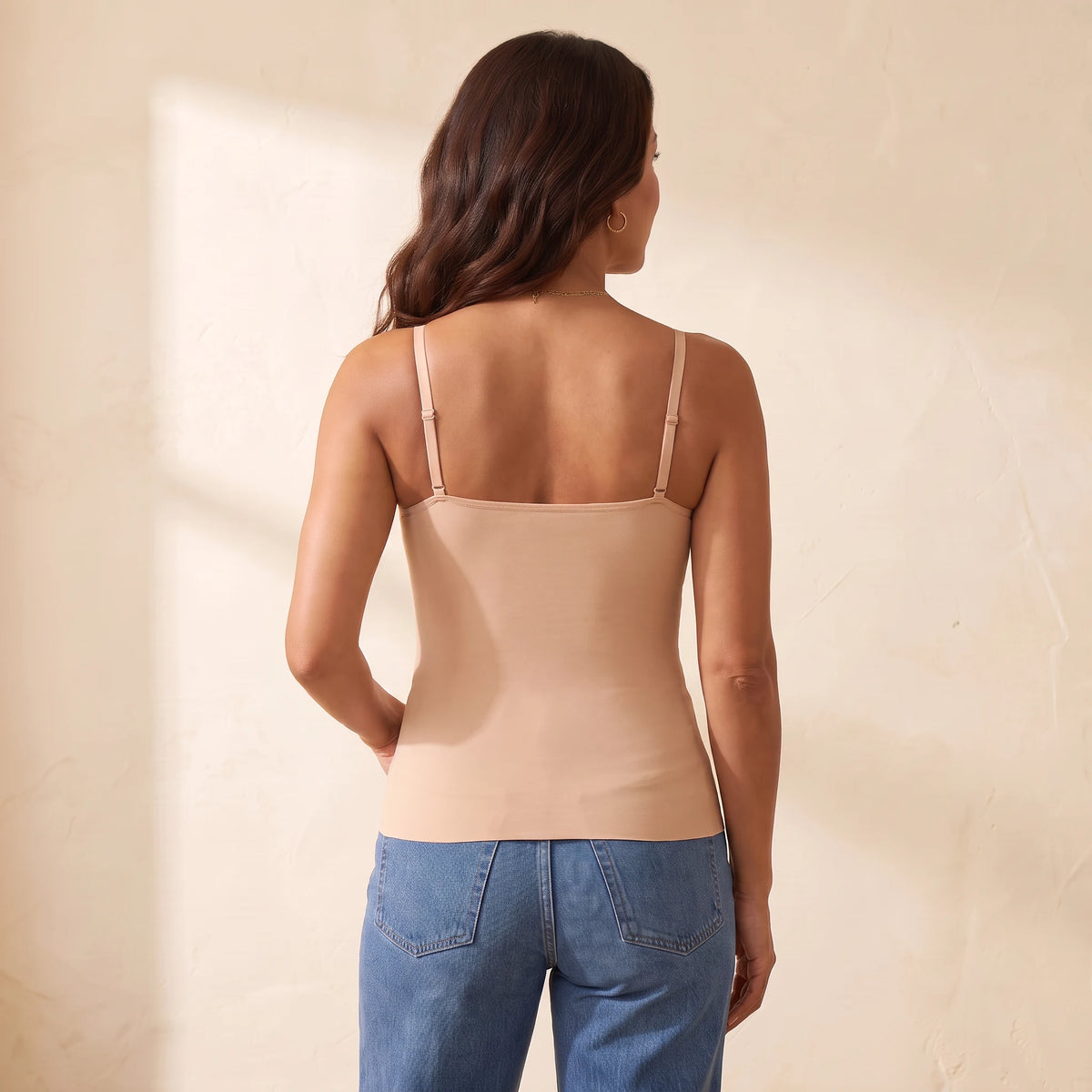 Back view of the Crème beige Kischt Aurelle tank top with thin adjustable straps and a smooth back with no bra lines