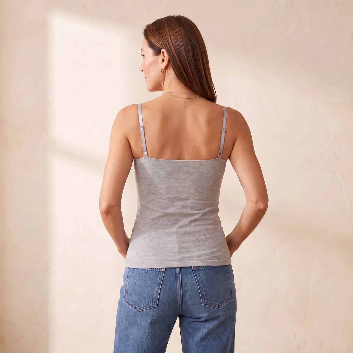 Back view of the Mist heather grey Kischt Aurelle tank top with thin adjustable straps and a smooth back with no bra lines