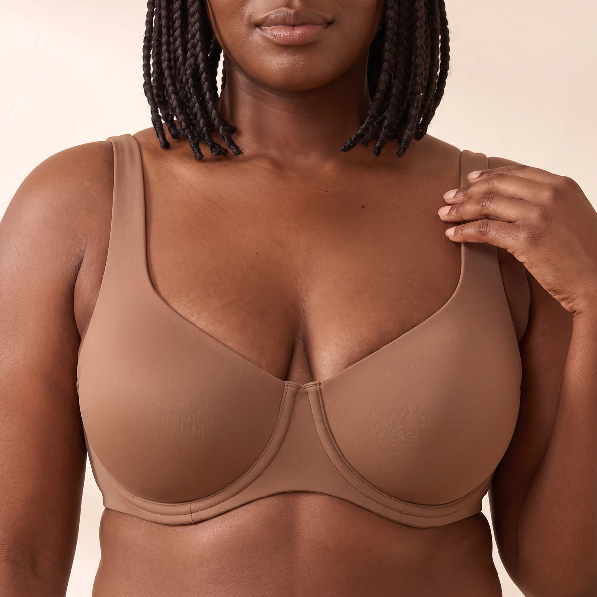 Close-up of the Mocha brown Kischt Camille balconette bra lifting from underneath with smooth unlined cups and wide straps