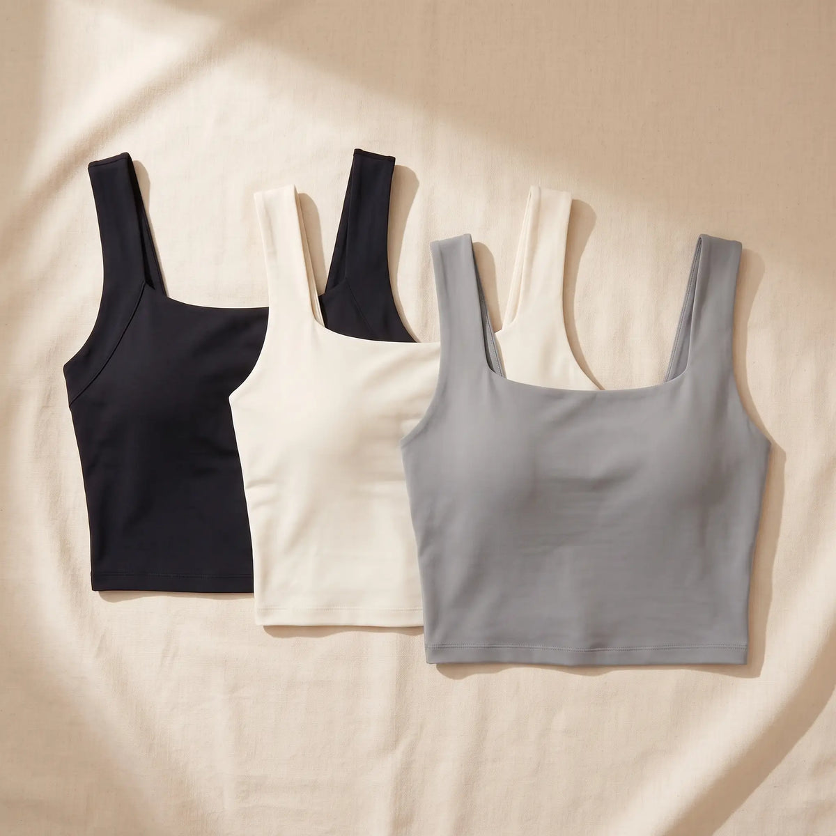 Kischt Elodie square neck built-in bra crop tank top 3-pack: The Everyday Trio in Noir black, Ivoire ivory, Gris grey