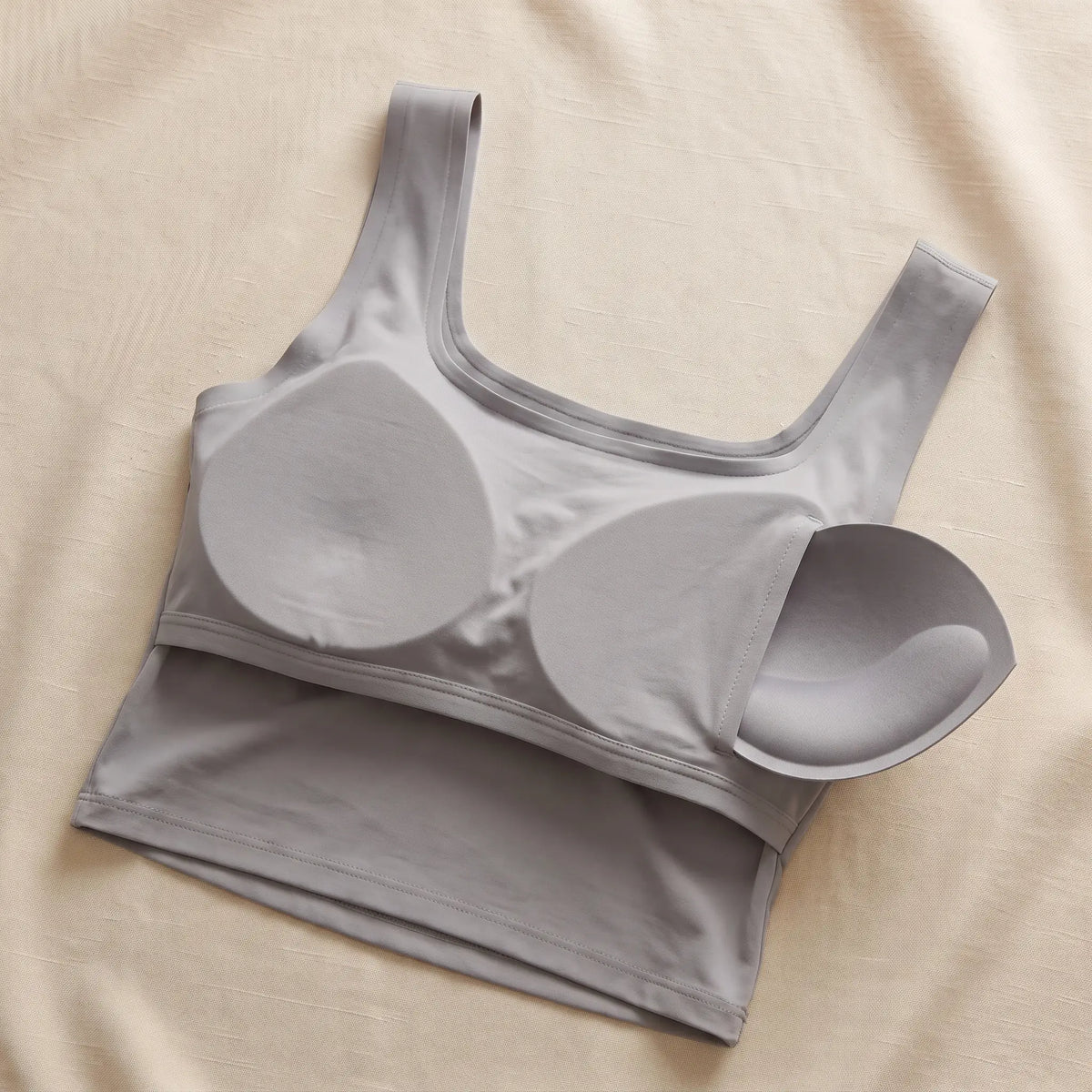 Inside of the Gris grey Kischt Elodie crop tank: a built-in bra lining with soft removable pads, no underwire
