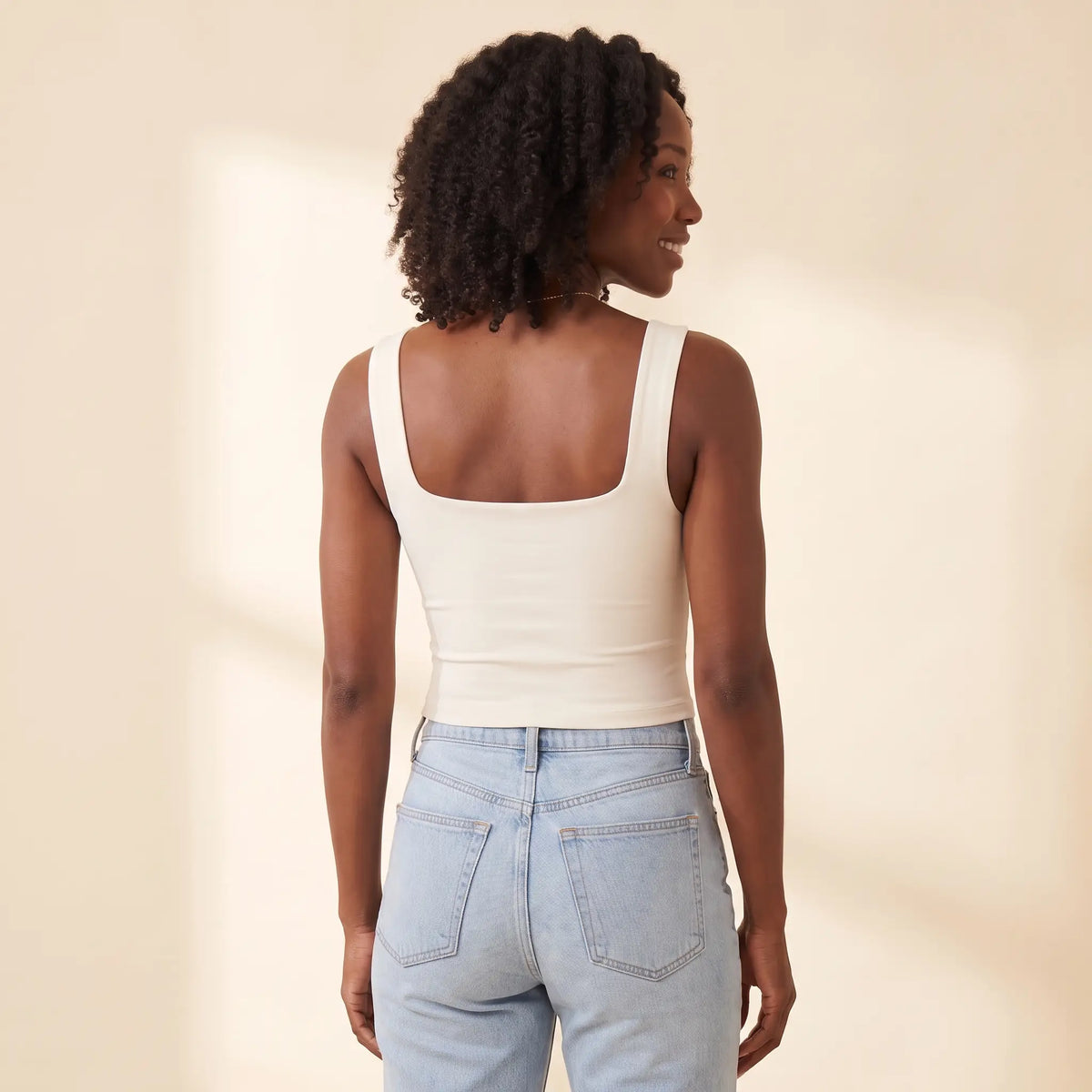 Back view of the Ivoire ivory Kischt Elodie square neck crop tank with wide straps and a smooth back with no bra lines