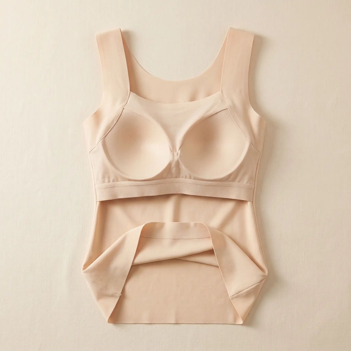 Inside of the Crème beige Kischt Estelle tank top: a built-in shelf bra with soft padded cups enclosed in a smooth lining on an elastic band