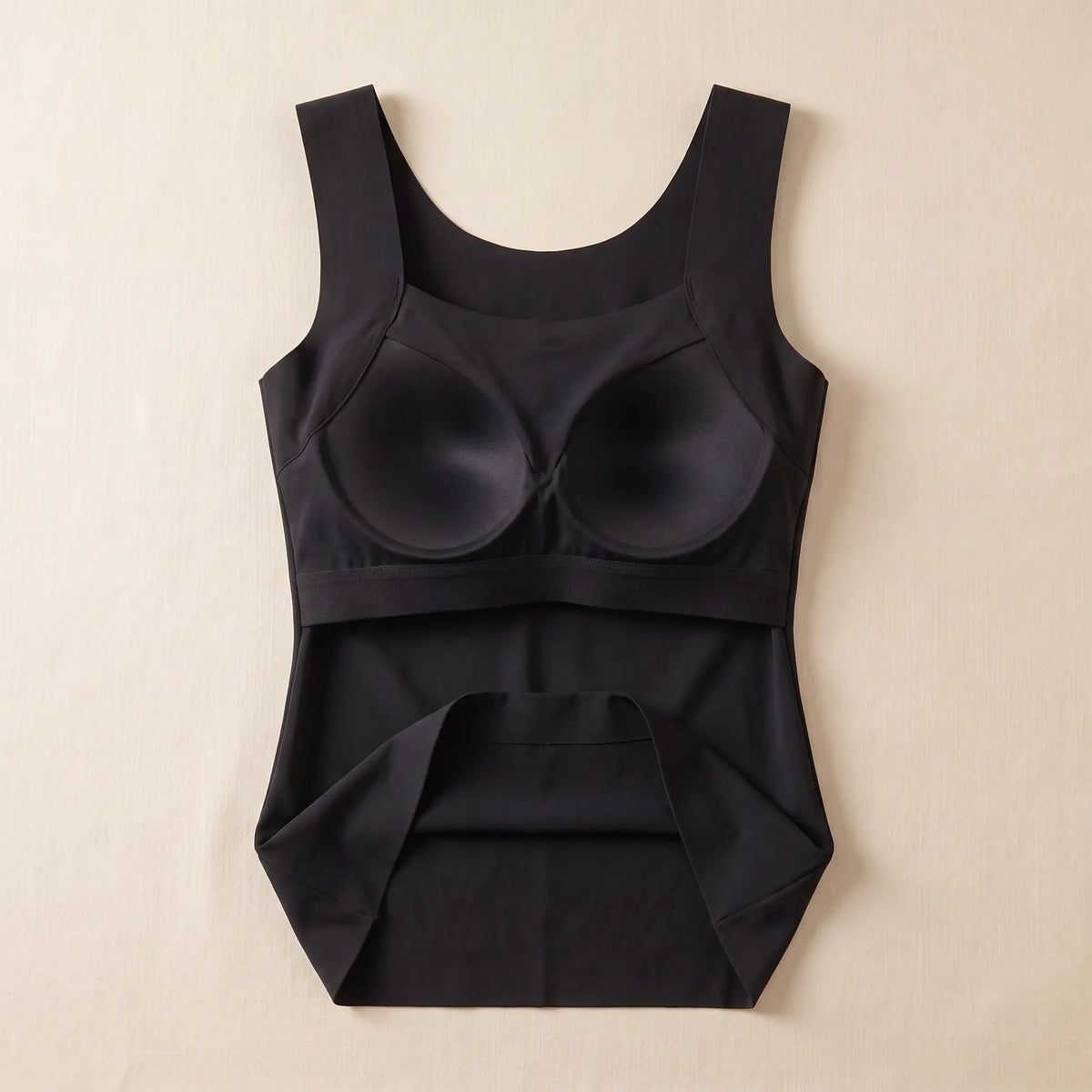 Inside of the Noir black Kischt Estelle tank top: a built-in shelf bra with soft padded cups enclosed in a smooth lining on an elastic band