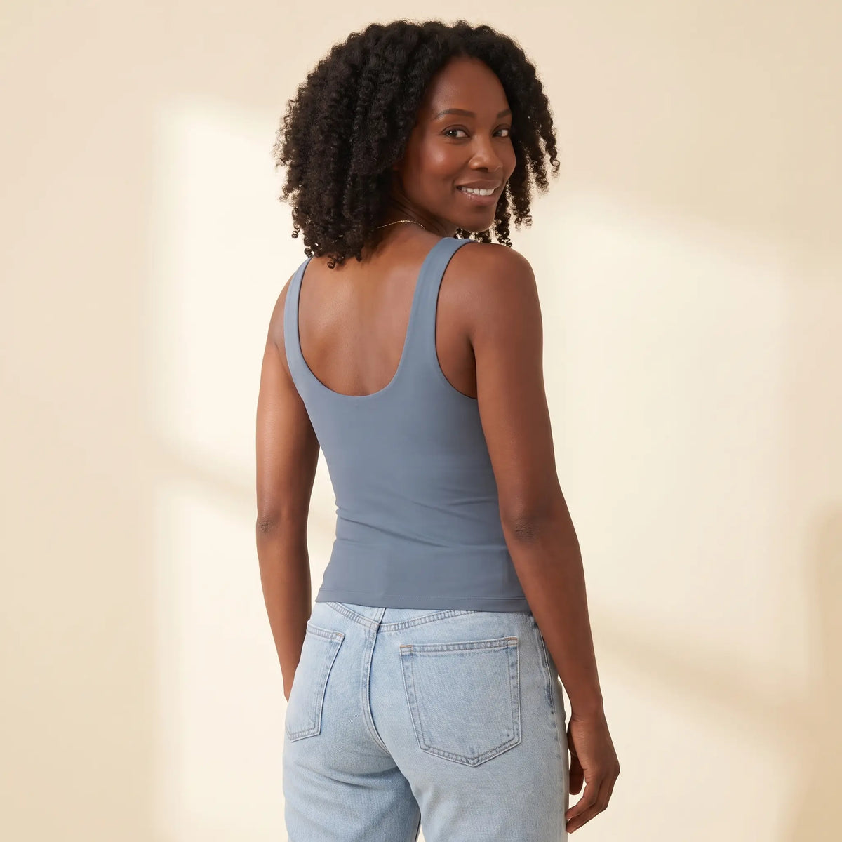 Back view of the Slate blue-grey Kischt Estelle tank top with wide straps and a smooth scoop back with no bra lines