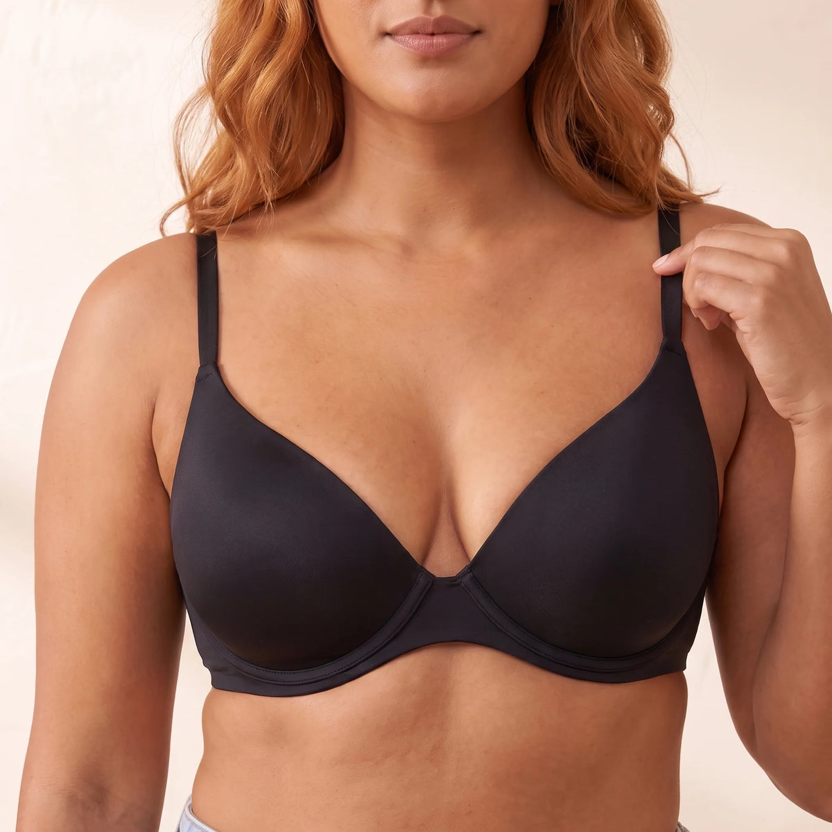 Close-up of the Noir black Kischt Juliette plunge bra: ultra-thin seamless unlined cups, a low centre gore and slim adjustable straps