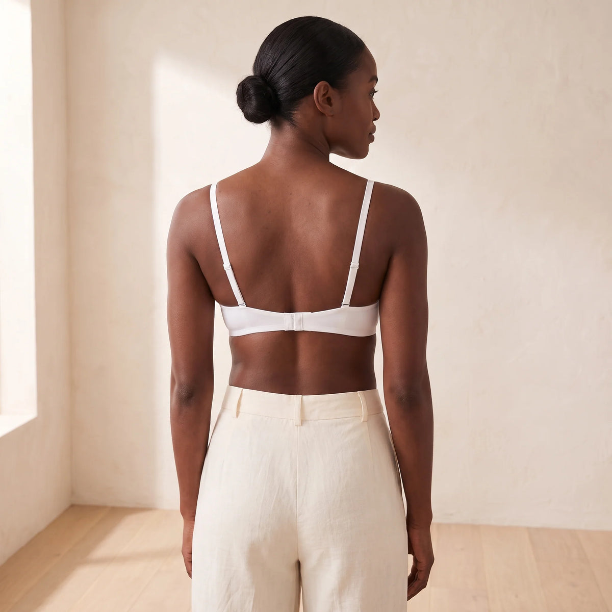Back view of the Blanc white Kischt Juliette plunge bra with adjustable straps and a smooth hook-and-eye back band