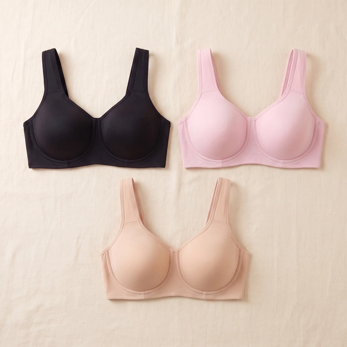 Kischt Léonie underwire sports bra 3-pack: The Signature Trio in Noir black, Blush pink and Crème nude