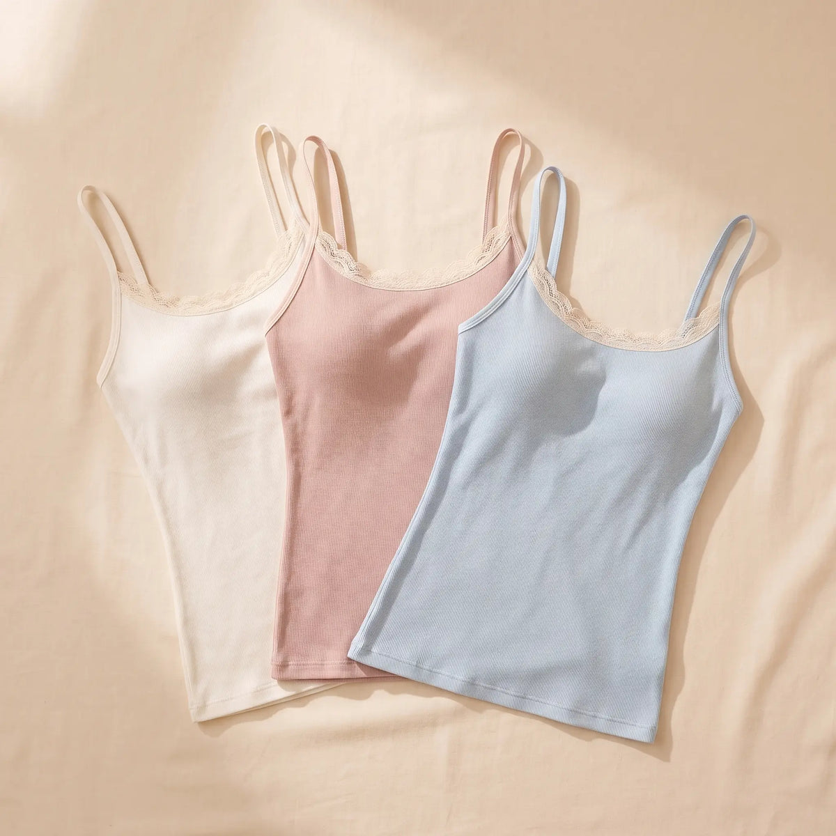 Kischt Lisette lace trim cami with built-in bra 3-pack: The Pastel Trio in Ivoire ivory, Poudre blush pink, Ciel pale blue