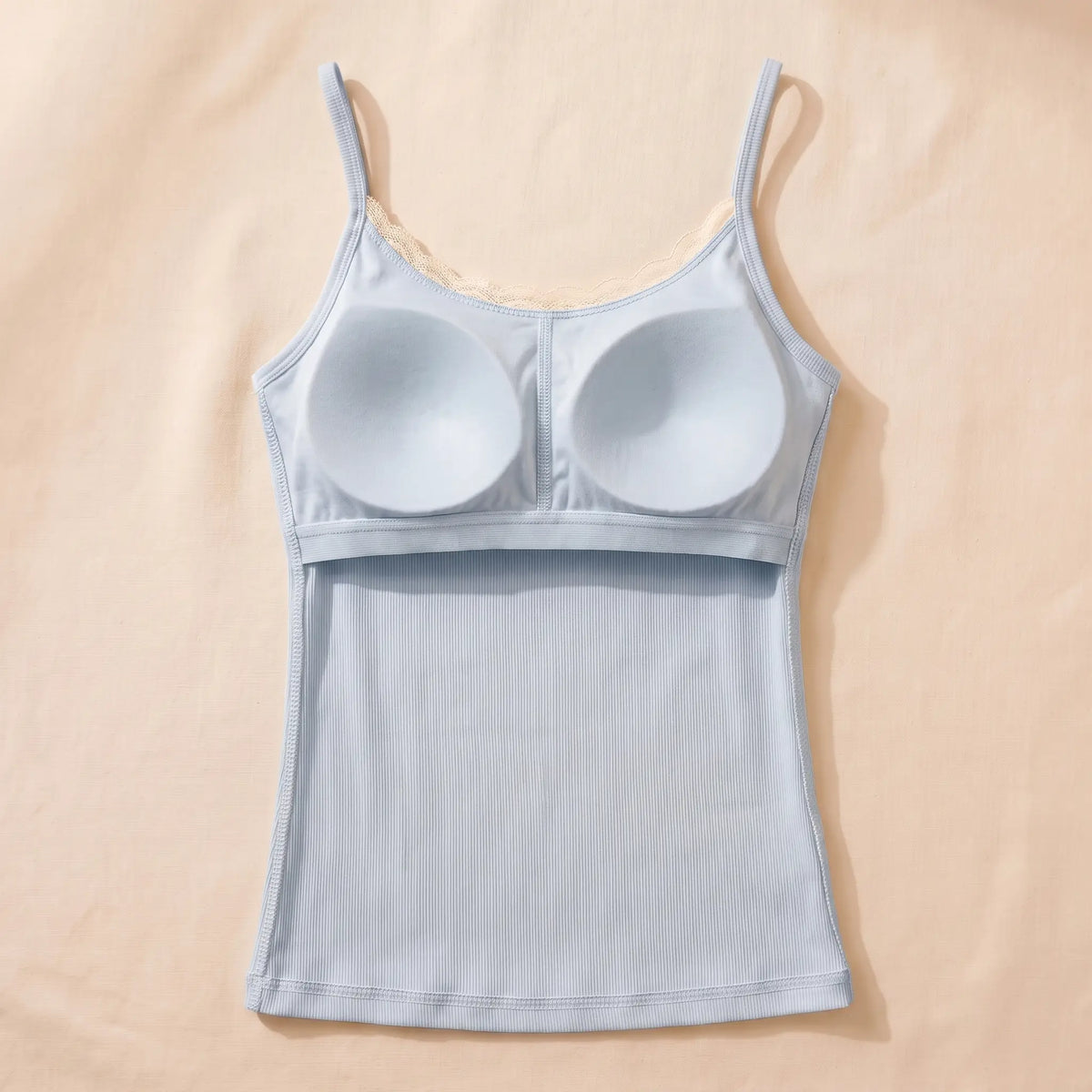 Inside of the Ciel pale blue Kischt Lisette cami: a built-in padded bra panel across the bust on an elastic band, no underwire