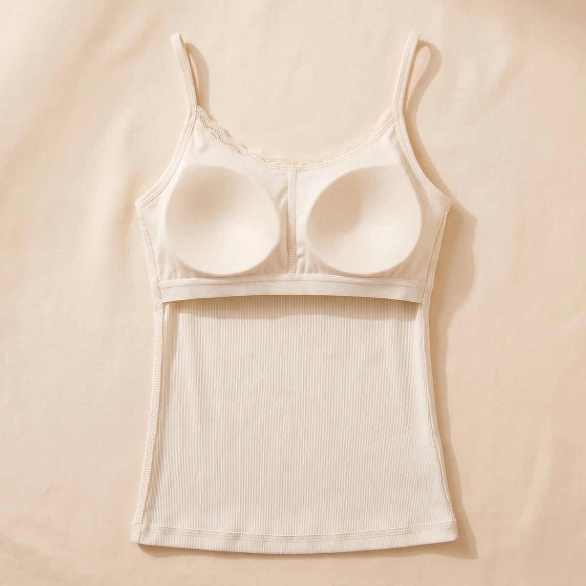 Inside of the Ivoire ivory Kischt Lisette cami: a built-in padded bra panel across the bust on an elastic band, no underwire