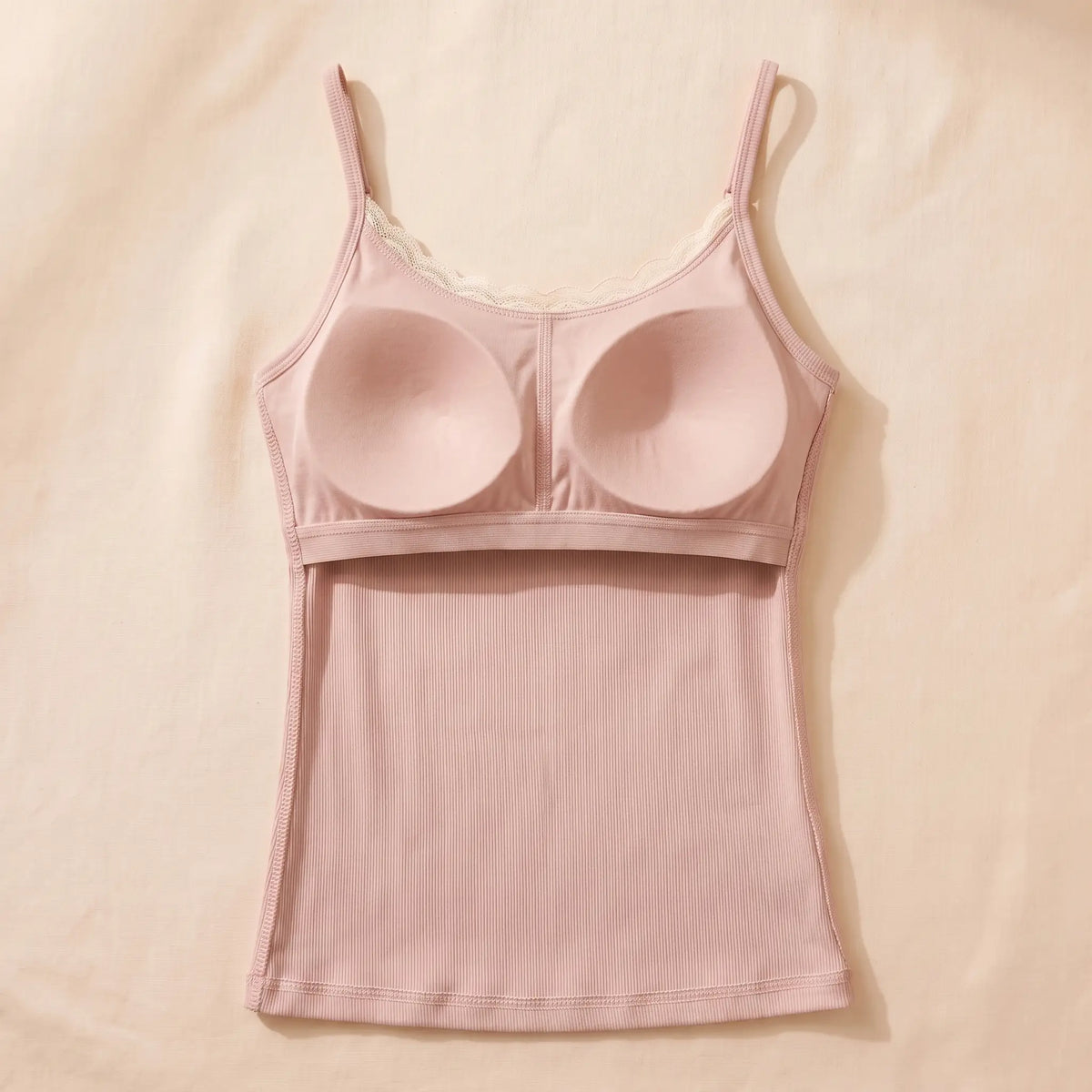 Inside of the Poudre blush pink Kischt Lisette cami: a built-in padded bra panel across the bust on an elastic band, no underwire