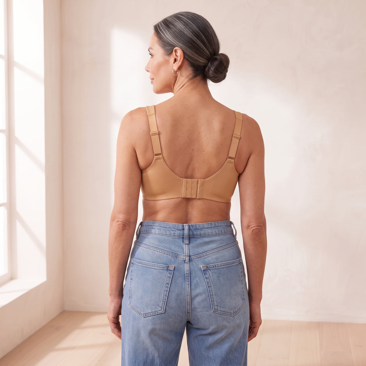 Back view of the Almond tan Kischt Margaux full coverage bra with wide straps and a wide hook-and-eye back band