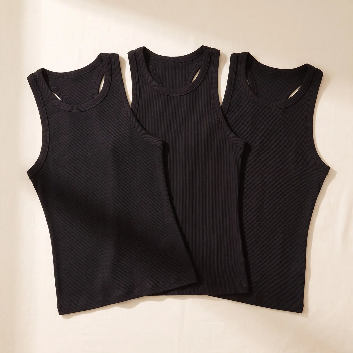 Kischt Noemi ribbed racerback built-in bra tank top 3-pack: The Triple Noir in Noir black
