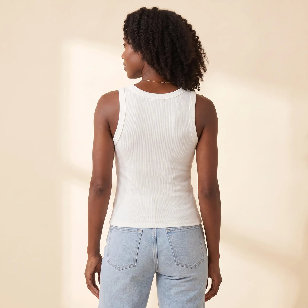 Back view of the Blanc white Kischt Solene ribbed crew neck tank top with a smooth back and no bra lines