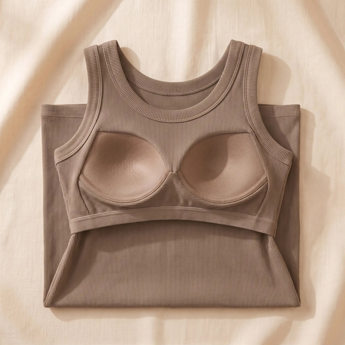 Inside of the Sable khaki Kischt Solene ribbed tank top: a built-in shelf bra with soft padded cups on an elastic underbust band, no underwire
